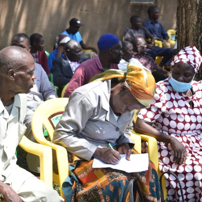 Farmers from Mwibale listen on during a farmers engagement forum